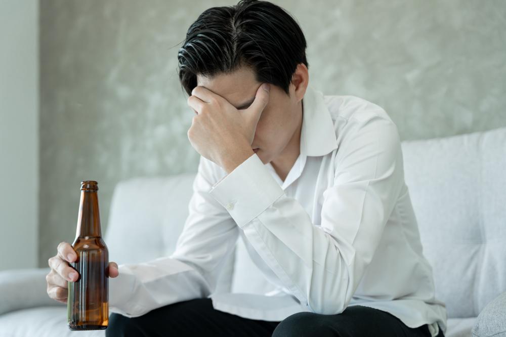 Man grappling with addiction as a concept for Adult IOP in California